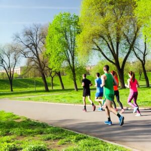 Group of athletes running in a park, showcasing activities that can lead to anterior shin splints