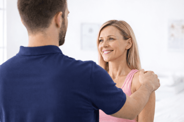 Shoulder Physiotherapy assessment guiding shoulder movement and control