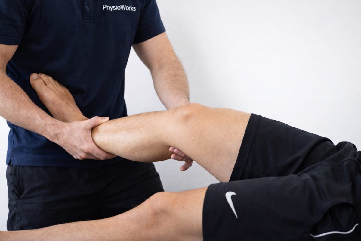 Physiotherapist performing a pivot-shift test to assess ACL-related knee instability